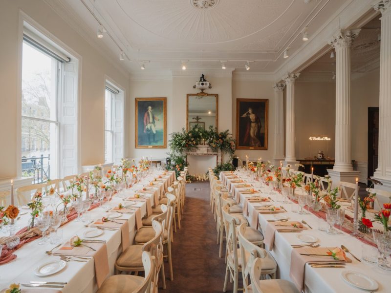 Banquet room decorated for a wedding with flowers and a feeling of whimsy