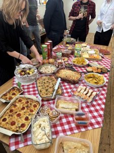 A large table full of a selection of savoury food.
