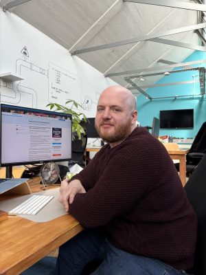 Rob Dennis sitting at his desk in the Fanatic office