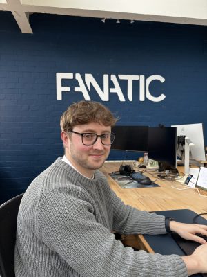 Sam C sitting at his desk in the Fanatic office