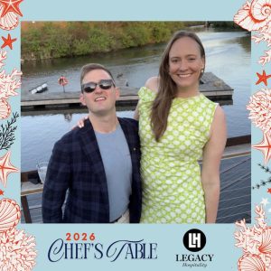 Dan attending Chef's Table 2026 fundraising event with Legacy Hospitality branding, standing by the Chicago river. There is a decorative seashell-themed frame around the photo.